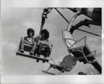 Two female students enjoying a carnival ride.